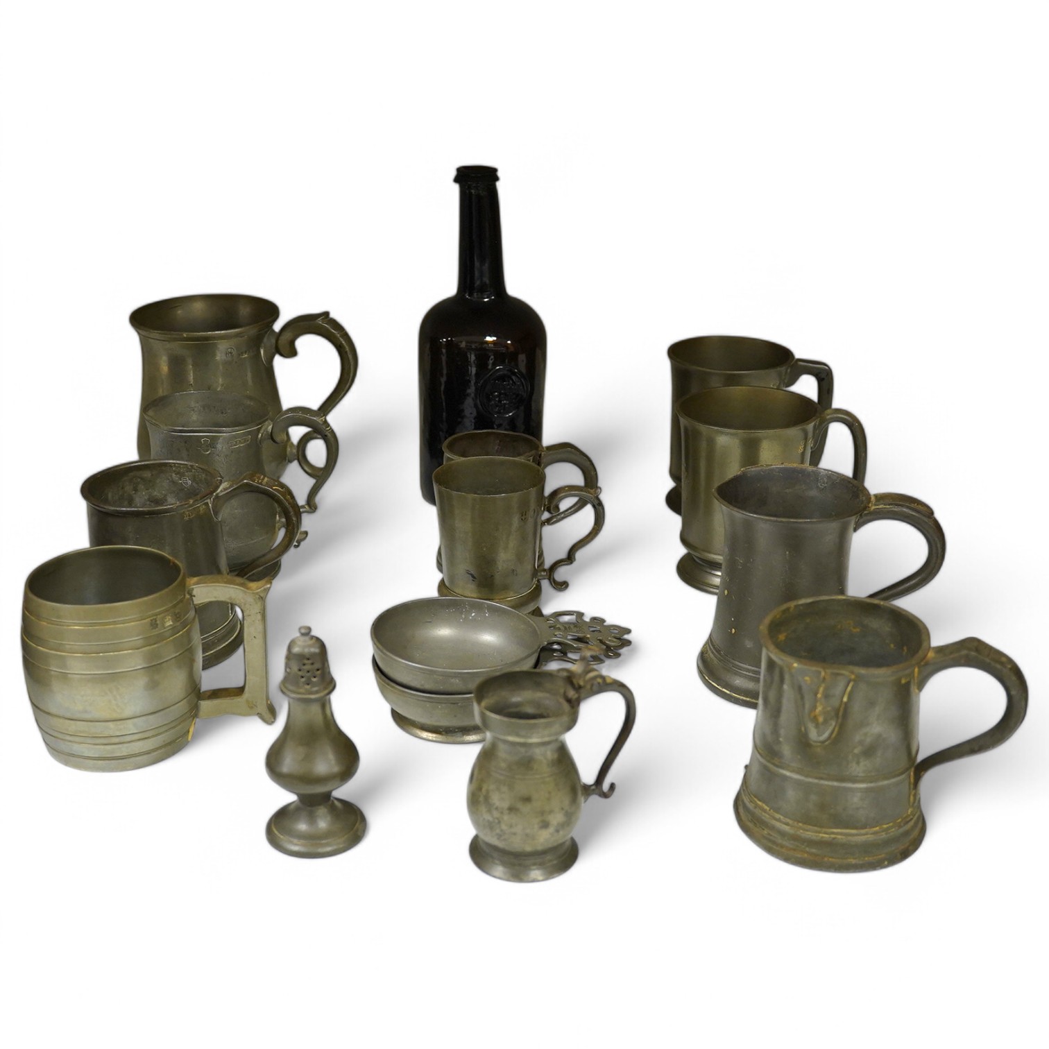 A collection of 18th and 19th century pewter mugs and other items including a 19th century wine bottle, bottle 27cm high. Condition - fair